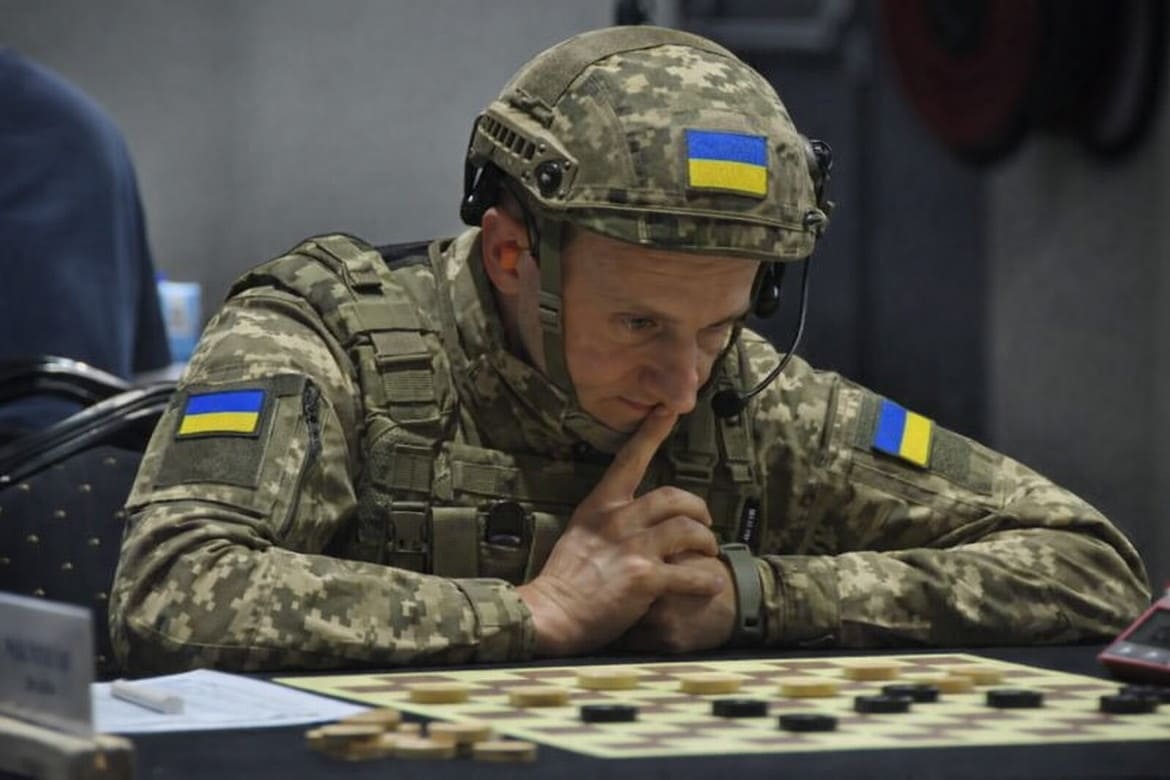 World Champion at War – The FMJD President Dines with Putin’s Cronies